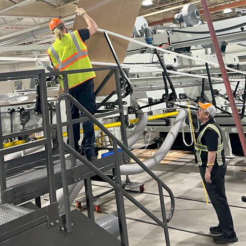 technician adjusting folding rods